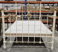 Victorian cast iron and brass double bedstead, later painted cream, having brass embossed panels,