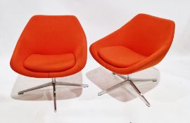 Pair of Allermuir open lounge chairs, model no. A640, upholstered in an orange fabric with cushion