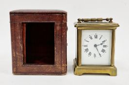 French gilt brass carriage clock, with swing handle to top, the white enamel face with Arabic