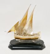 800 grade silver model of a middle eastern dhow sailing boat, mounted in an ebonised stand, dhow