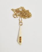 9ct gold and orange stone set pendant, tie shaped with engine-turned decoration, on fine gold chain,