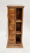 20th century hardwood revolving CD rack of square form with carved square decoration, on a plinth