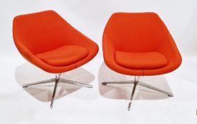 Pair of Allermuir open lounge chairs, model no. A640, upholstered in an orange fabric with cushion