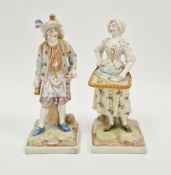 Pair of late 19th century continental pottery figures, one of a bell ringer the other a lady selling