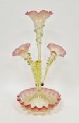 Victorian vaseline glass three-trumpet epergne, trailed in pale green and with a single green