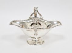 Edward VII silver double-lipped footed sauceboat, with gadrooned rim, foliate and palmette cast