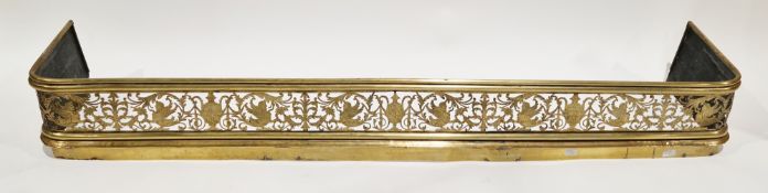 Early 19th century brass fender, the front having pierced decoration of classical mythical creatures