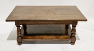 Oak coffee table of rectangular form, on turned baluster and square supports united by an