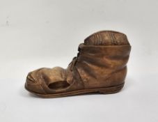Early 20th century carved treen inkwell in the form of a boot, having two hinged lids, one opening