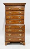 Antique reproduction oak tallboy, each of the two sections with four long drawers, brass handles, on