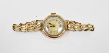 9ct gold cased lady's wristwatch, the gilt dial with Arabic numeral hour markers, gold plated