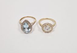 Two lady's 9ct gold dress rings, one set with white stones the other with a pink pear-shaped stone