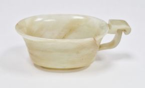 Chinese carved pale jade libation cup, probably Qing Dynasty with pierced archaic style handle,