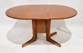 G-Plan teak drop-leaf dining table, circa 1980's, the top of oval form on four splayed legs united
