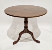 George III mahogany supper table, the circular tilt-top on a turned baluster ringed support with