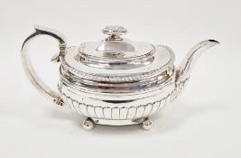 George III silver teapot, of oval form, cast with foliate knop, gadrooned rims and lower part,