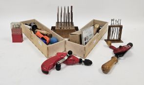 Assortment of engineering and woodworking tools and parts including many mini pliers, needle