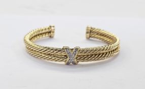 14K gold and diamond bangle, the double ropetwist pattern having diamond set cross with nine claw