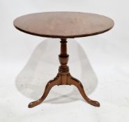 George III mahogany supper table, the circular tilt top with bird-cage action, on turned baluster