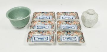 Chinese celadon peony bowl, moulded with peony amongst scrolling leaves, with dark brown washed base