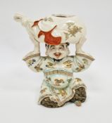 Japanese late Meiji period (1868-1912) satsuma figure of a seated gentleman balancing a sack on
