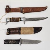 German Boker Solingen hunting knife with steel blade and antler handle held in a leather sheath with