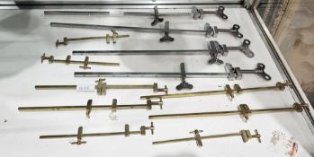 Twelve mini sash cramps by Yamazaki, in six sizes, eight in brass, four steel (12)