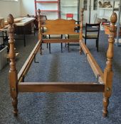 Pair of American maple single bedsteads,  with shaped solid headboard and supports with carved
