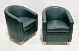 Pair of modern dark green stitched leather tub armchairs on pale oak square tapering legs, 81cm high