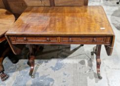 19th century mahogany and ebony inlaid sofa table, on out swept legs with brass caps and castors,