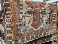 Large ivory ground rug with geometric medallion, geometric spandrels and multiple floral and