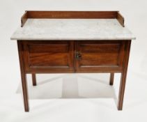 Edwardian mahogany washstand, the rectangular marble top with a half upstand over two cupboard