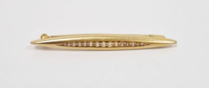 14ct gold bar brooch set with graduated seedpearls in elliptical setting, stamped 14K, 3.1g approx.