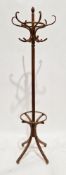 Modern Thonet-style bentwood coat and stickstand having six scrolling coat hooks, 198cm high