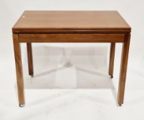 Mid-century teak card table, possibly by Hubbinet Limited, having a rectangular swivel folding top