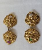 Pair 14k gold and gemstone mask/green man cufflinks, each cufflink with two mask variants, one