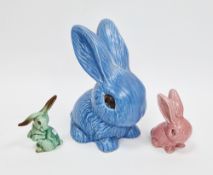 Three Sylvac models of rabbits, various impressed marks, comprising a large blue example, shape no.