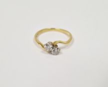 18ct gold and diamond ring, crossover set two claw set stones each 0.15ct approx.