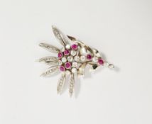 White metal, diamond and red stone spray brooch having numerous diamond and red stones, probably