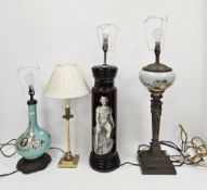 Three table lamps in the 19th century style including brass lamp with floral patterned glass well on