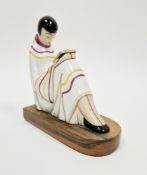 French 'Argilor, Paris' Art Deco figural bookend, modelled as a lady reading, wearing striped