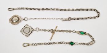 Silver-coloured metal ornate albert chain set with green stones and having silver pendant fob with
