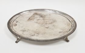 George III silver salver, of oval form, the centre engraved with entwined initials surmounted by a