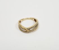 9ct yellow gold and diamond cross-over ring, comprising two rows of small mixed cut diamonds, size O