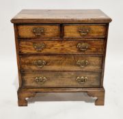 Reproduction Georgian-style oak chest of two short over three long drawers with brass handles, on