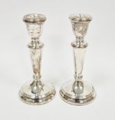 Pair of 20th century silver small table candlesticks (weighted), each with tapering stem and on