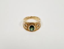 Lady's 9ct gold ring set with a central oval green tourmaline(?), flanked on either side by three
