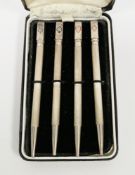 Cased set of sterling silver propelling bridge pencils, each with a square finial having a different
