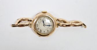 Gold cased lady's wristwatch, the circular dial with Arabic numeral hour markers, expanding yellow