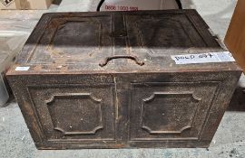 18th century cast-iron strong box, of panelled form, the hinged lid with loop handle and brass